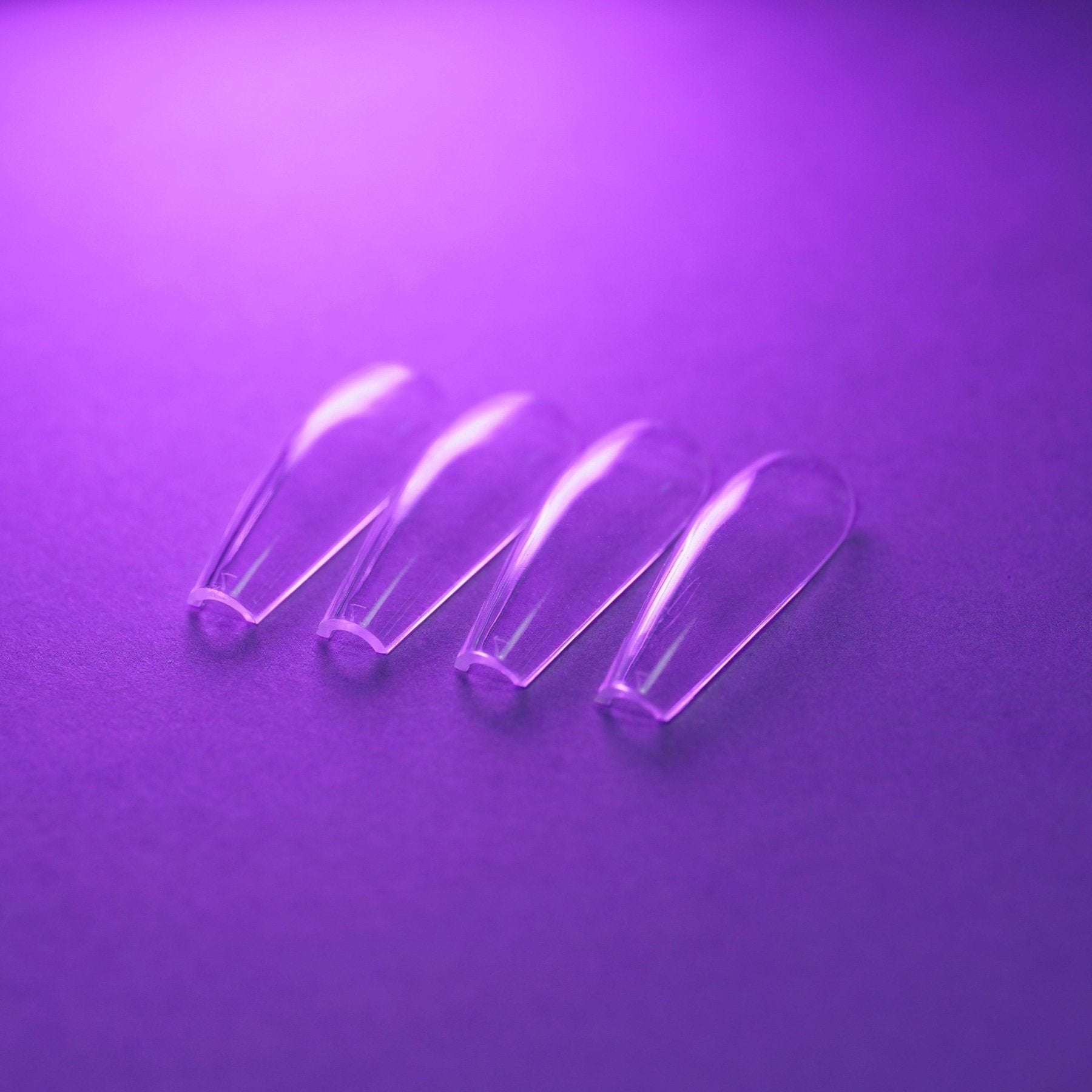 Capsules américaines ballerine longue transparentes posées à plat, second angle