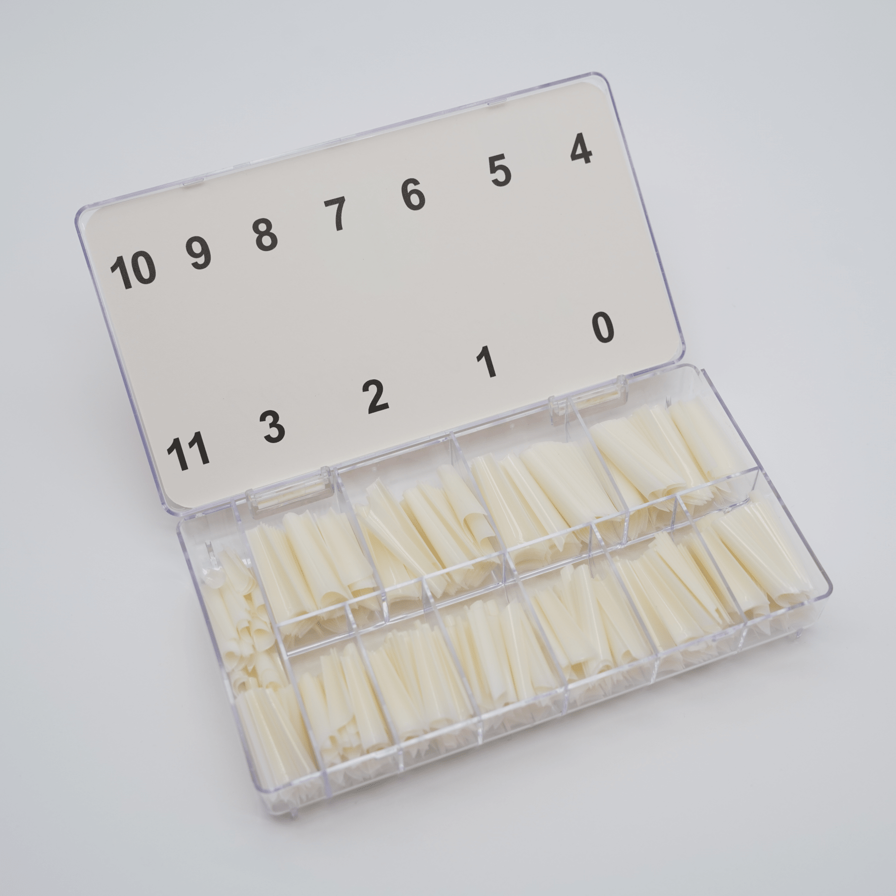 Boîte ouverte des Capsules C-curve NAILS FRS, compartiments numérotés de 0 à 11