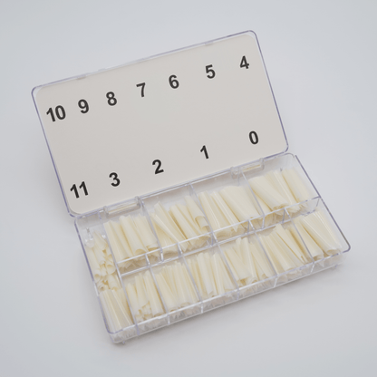 Boîte ouverte des Capsules C-curve NAILS FRS, compartiments numérotés de 0 à 11