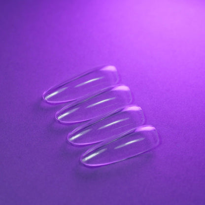 Capsules américaines amande longue natural transparentes posées à plat